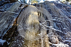 mountain side covered in ice in forest Narke Sweden