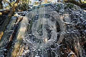 mountain side covered in ice in forest Narke Sweden