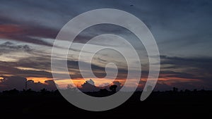 Mountain silhouette and electric pole when the sunset