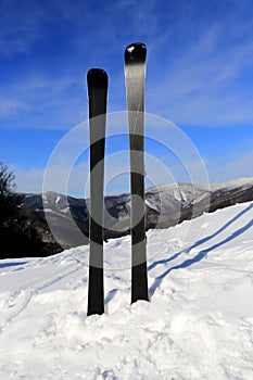 Mountain ski on snow at sunny day