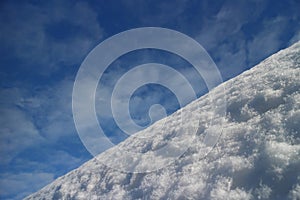 Mountain slope white snow blue sky