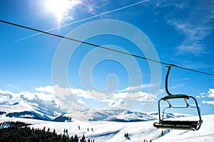 Mountain slopes with chairlift photo