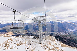 Mountain slopes with chairlift on a winter sunny day Winter mountains panorama with ski slopes and ski lifts near Brasov ski cent