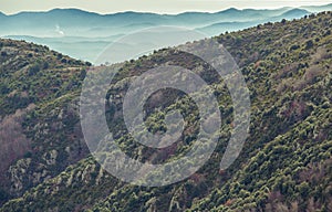 Mountain slopes and faraway blue mountains