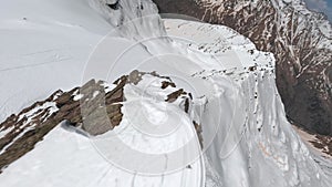 Mountain stone cliff ridge structure snow winter frost landscape ski tour aerial panorama view