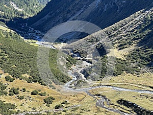 Mountain stream Aua da Grialetsch in the beautiful autumn setting of the alpine valley Val Grialetsch of the Albula Alps massif