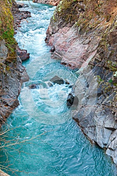 Mountain stream flowing through the red rocks