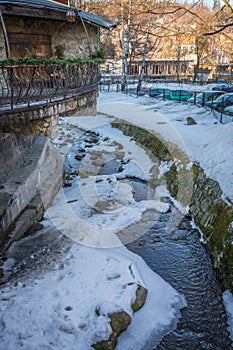 Mountain stream flowing under the restaurant