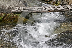 Mountain stream with footbridge