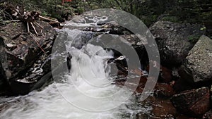 Mountain Stream Tumbling Through Boulders