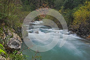 Mountain stream turquoise blue water long exposure effect