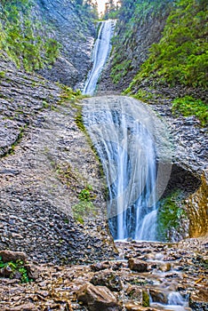 Mountain stream and waterfall on rocks