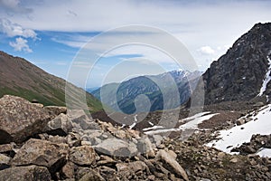 Mountain summer landscape with snow, Talgar pass in the Zailiyskiy Alatau mountains above the city of Almaty