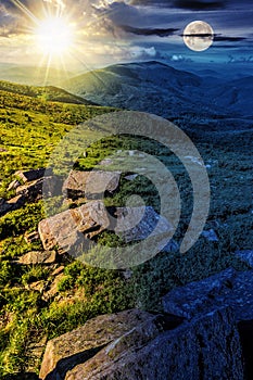 mountain summer landscape with sun and moon at twilight