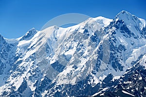 Mountain summit under snow