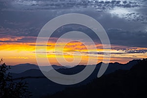 mountain sunset having clouds sky