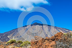 The mountain Teide in Tenerife on a sunny day with a shadow on t