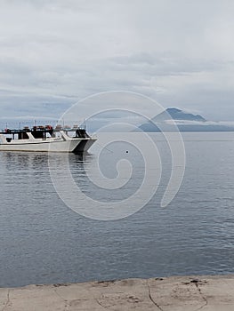 The mountain there is Bunaken Island and local people usually call that island Manado Tua Island