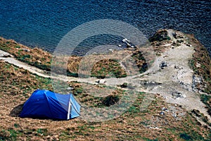 Mountain top. adventures Camping tourism and tent. landscape near water outdoor at Lacul Balea Lake, Transfagarasan, Romania.