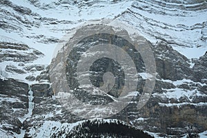 Mountain top is covered in snow.