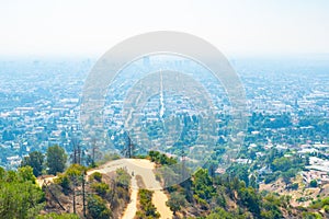 Mountain top hiking trails overlooking modern city