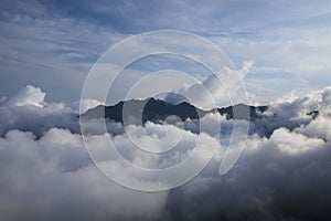 Mountain top over clouds