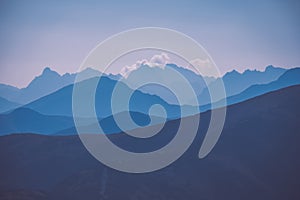 Mountain top panorama in autumn covered in mist or clouds - vin