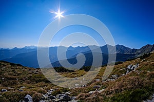 Mountain top panorama in autumn covered in mist or clouds