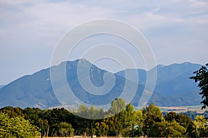 Mountain top panorama in autumn covered in mist or clouds