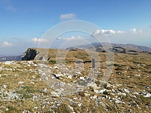 Mountain top rocky terrain and scarce vegetation