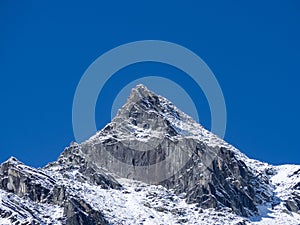 Mountain top with snow and clear blue sky