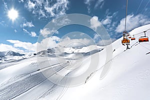 Mountain top view in winter. Ski routes in the mountains. Snowy winter mountain background.