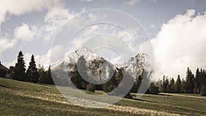 Mountain tops in autumn covered in mist or clouds - soft vintag