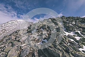 Mountain tops in autumn covered in mist or clouds- vintage effe