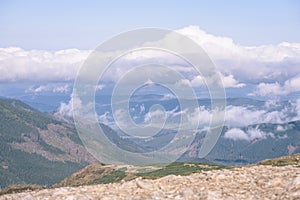 Mountain tops in autumn covered in mist or clouds - vintage ret