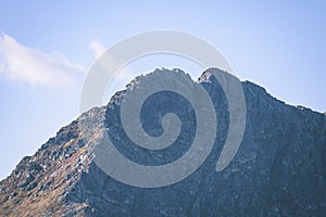 Mountain tops in autumn covered in mist or clouds - vintage ret