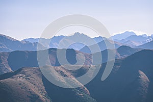 Mountain tops in autumn covered in mist or clouds - vintage ret