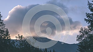 Mountain tops in autumn covered in mist or clouds - vintage ret