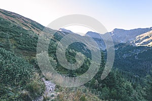 Mountain tops in autumn covered in mist or clouds - vintage ret