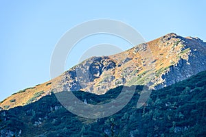 Mountain tops in autumn covered in mist or clouds