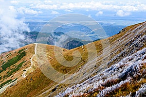 Mountain tops in autumn covered in mist or clouds