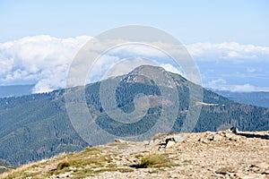 Mountain tops in autumn covered in mist or clouds