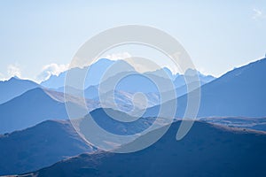 Mountain tops in autumn covered in mist or clouds