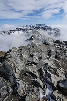 Mountain tops in autumn covered in mist or clouds