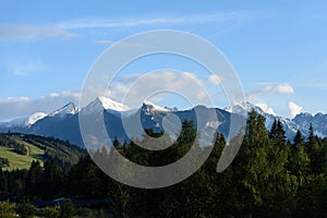 Mountain tops in autumn covered in mist or clouds