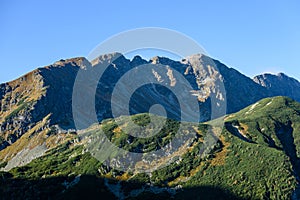 Mountain tops in autumn covered in mist or clouds