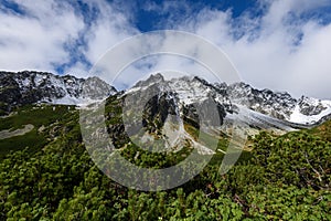 Mountain tops in autumn covered in mist or clouds