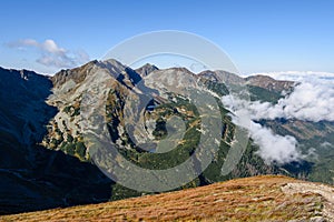 Mountain tops in autumn covered in mist or clouds