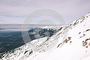 Mountain tops in winter covered in snow - vintage film look