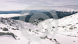 Mountain tops in winter covered in snow - vintage film look